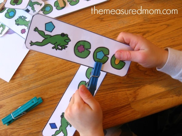child clipping frog card