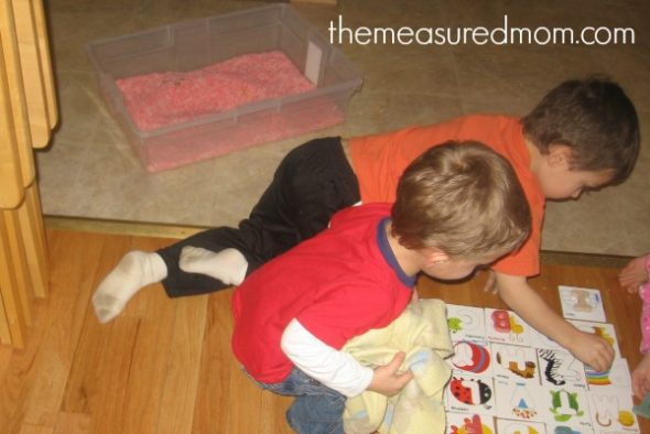 children playing with letters and letter cards