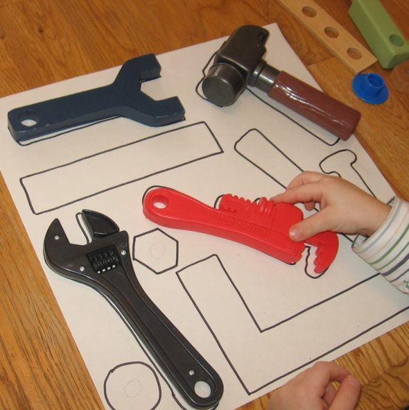 child with tool match-up letter T