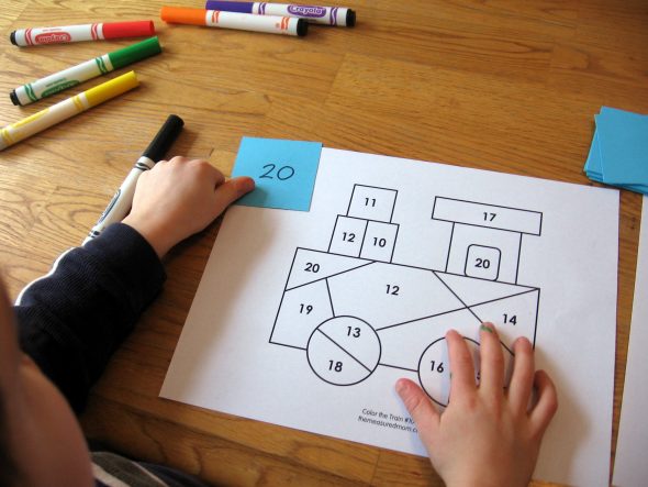 child with coloring race worksheet letter T