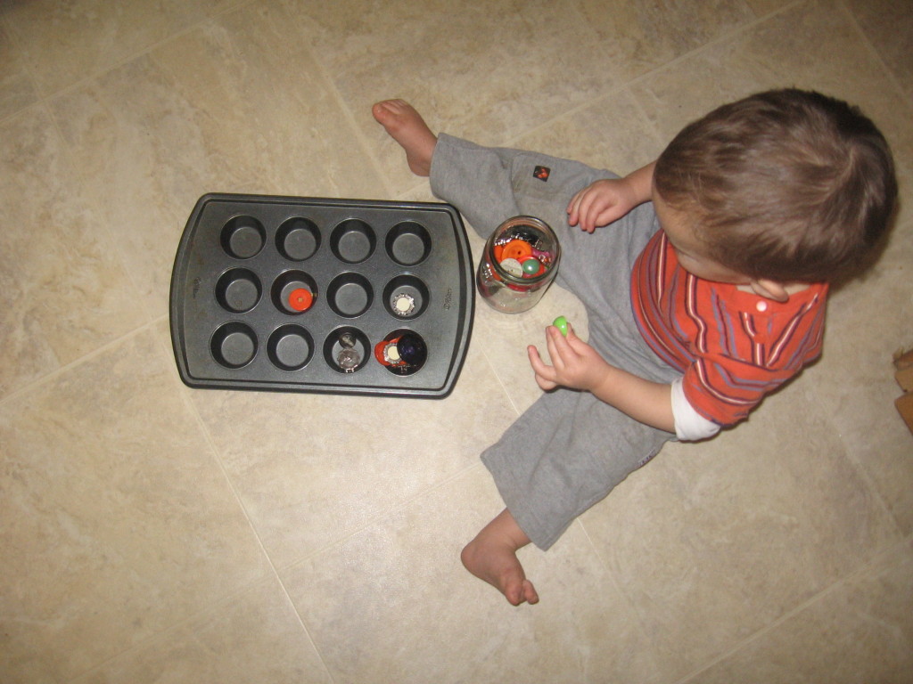child holding button