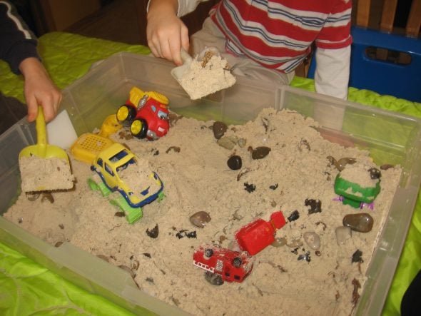 children dumping sand