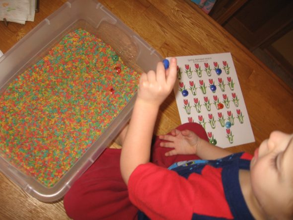 child with spring tulips printable, gems, and colored alphabet pasta