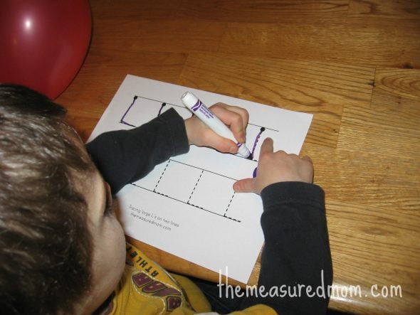 child forming L's on letter L worksheet