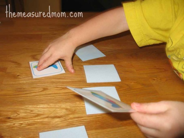 child playing matching transportation memory game