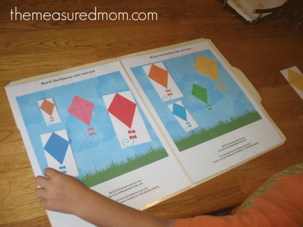child playing free kite file folder game - color matching and size sort 