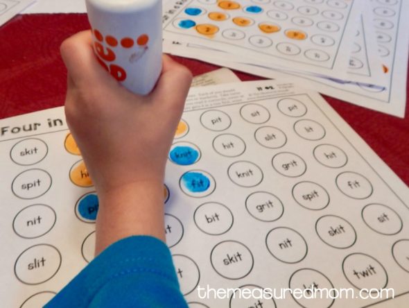 Get our free four-in-a-row games for reading short i words!