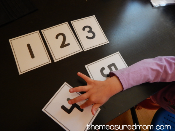 Here are five ways to use number cards with your preschooler. Get free printable cards, too! 