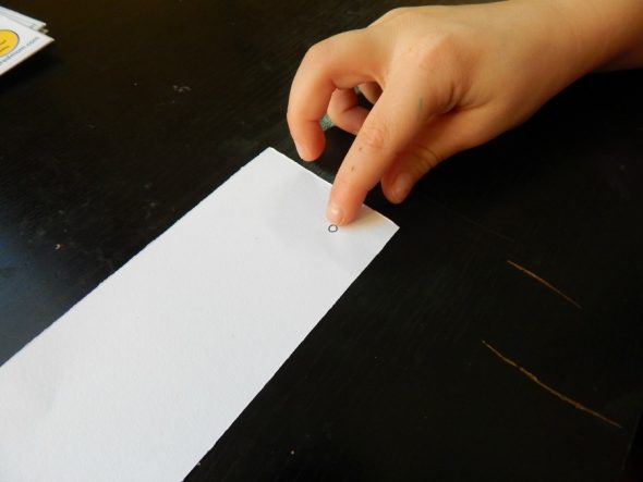 Child practicing rhyming with printable