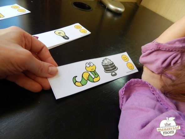 Child practicing rhyming with printable