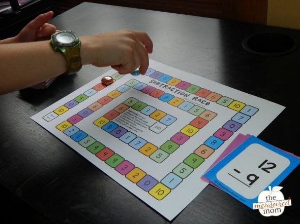 child playing subtraction game