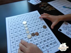 Counting money with a hundred chart - The Measured Mom