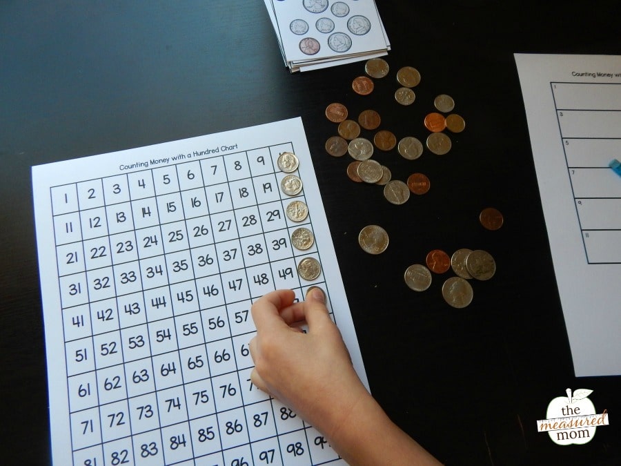 Counting money with a hundred chart - The Measured Mom