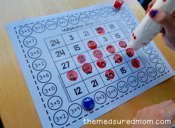 child dotting with do-a-dot marker on game